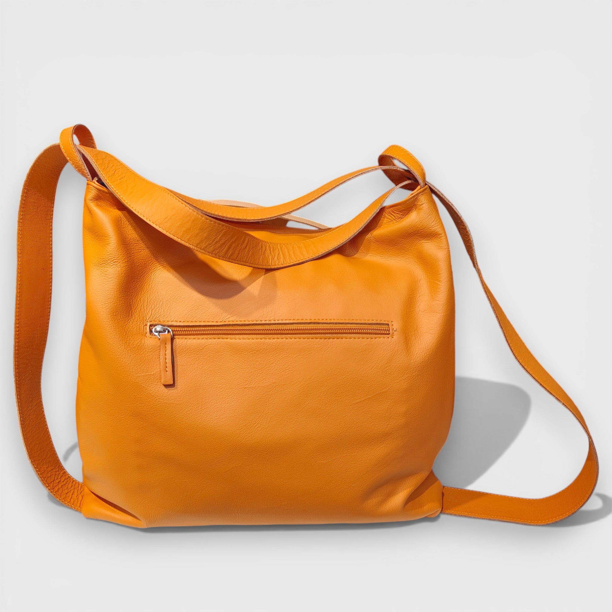 Pelletteria Pelle Nuda Milano, Artigianato Italiano, Vera pelle, Negozio borse donna, Zaino Roma arancione