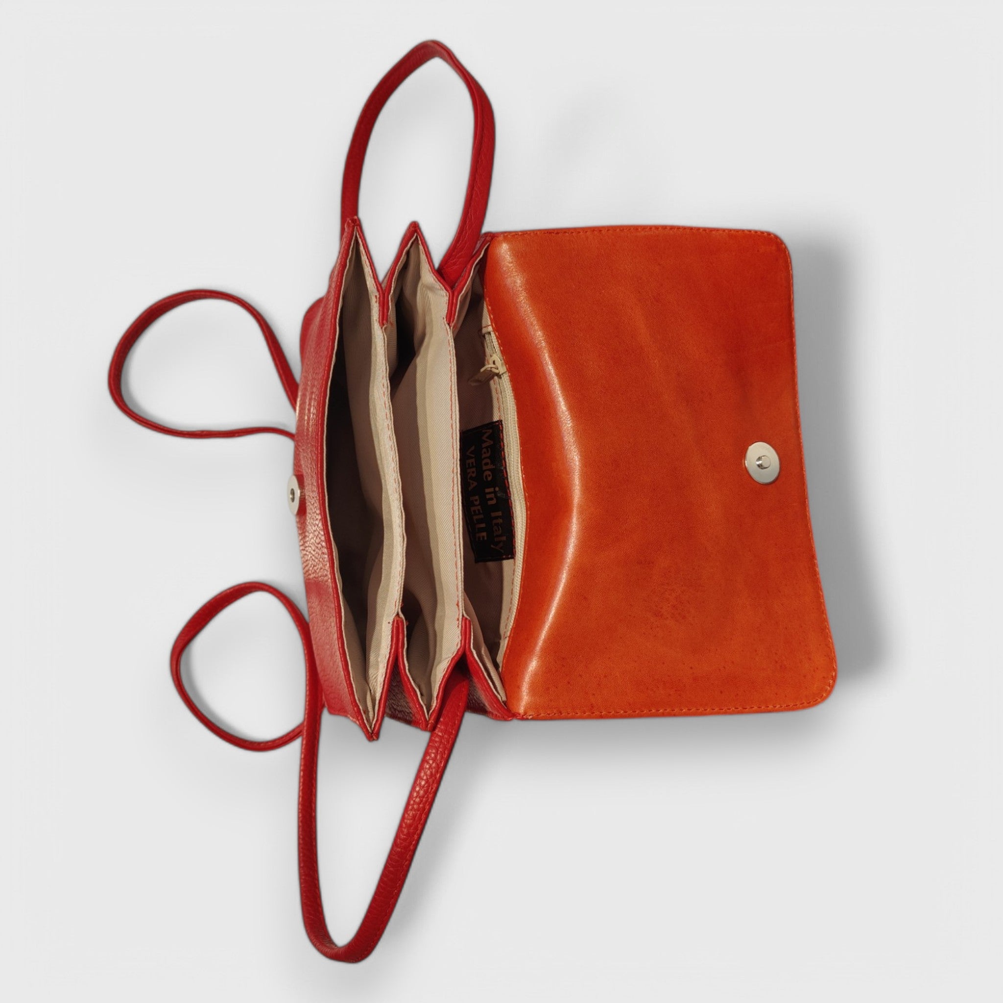 Pelletteria Pelle Nuda Milano, Artigianato italiano, Negozio borse donna, Vera pelle, Tre soffietti rosso