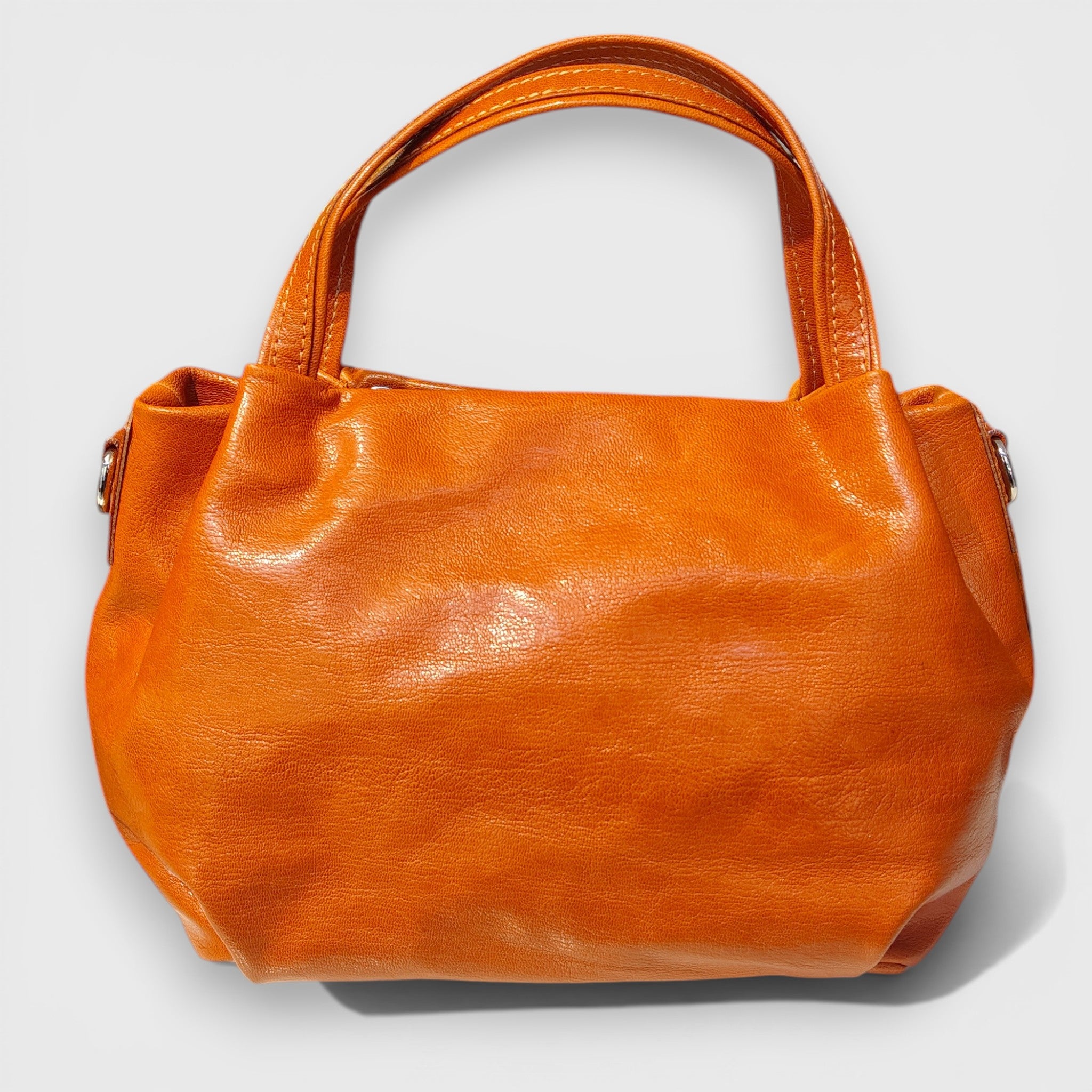 Pelletteria Pelle Nuda Milano, Artigianato Italiano, Vera pelle, Negozio borse donna, Andrea arancione