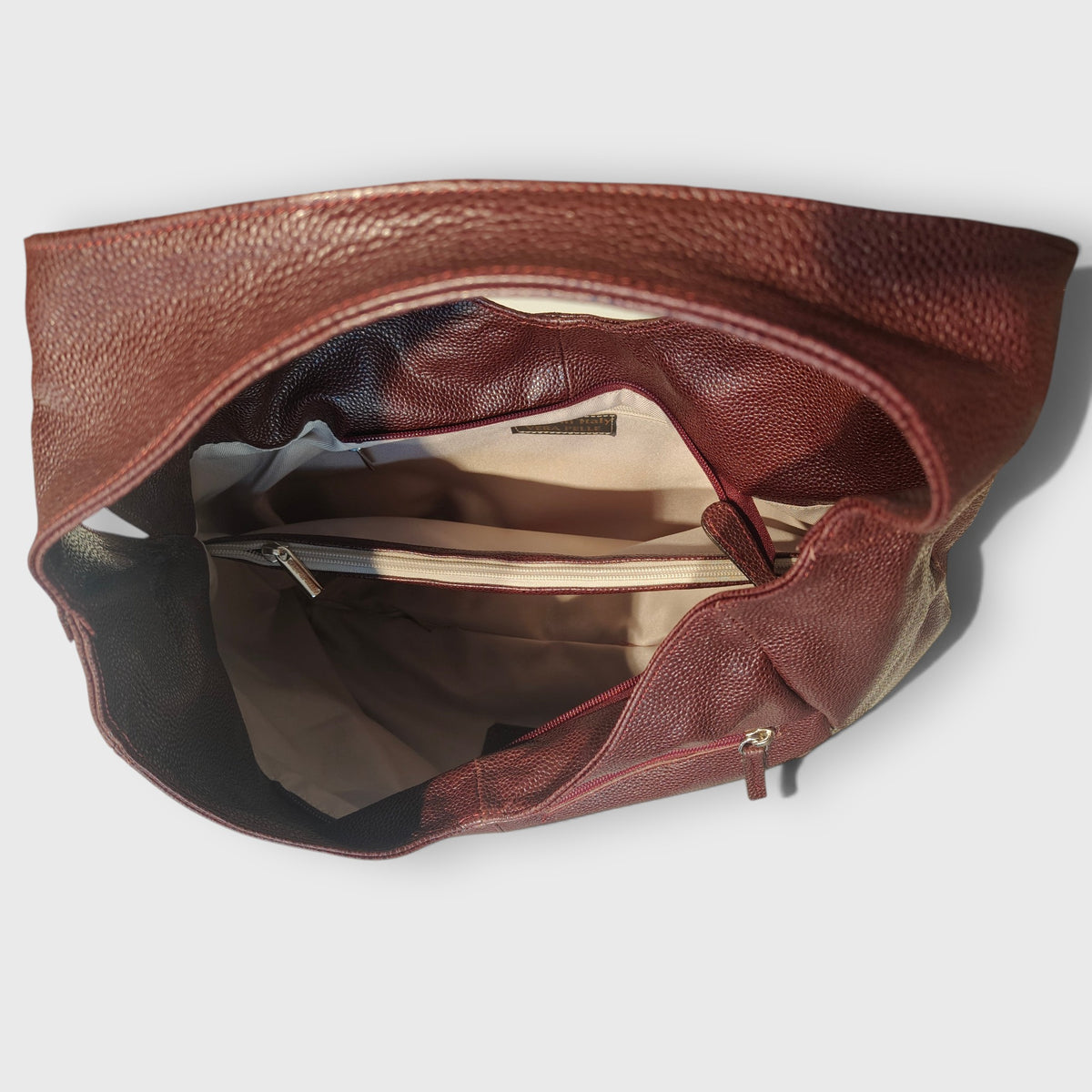 Pelletteria Pelle Nuda Milano, Vera pelle italiana, Negozio borse donna, Barchetta bordeaux