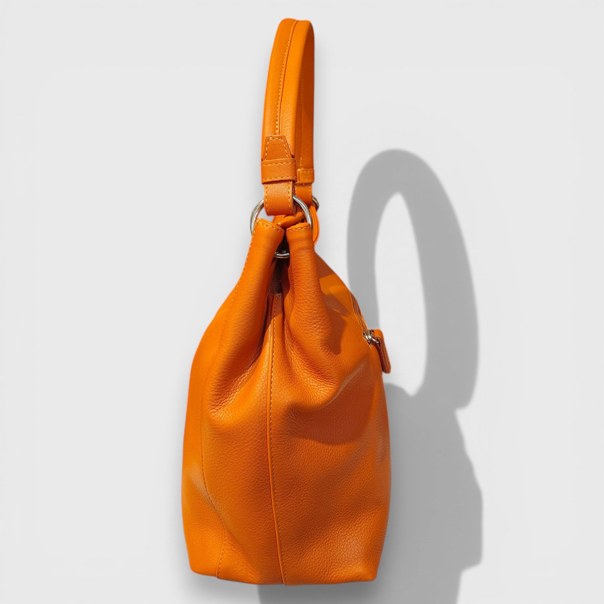 Pelletteria Pelle Nuda Milano, Artigianato Italiano, Vera Pelle, Negozio borse donna, Cris arancione