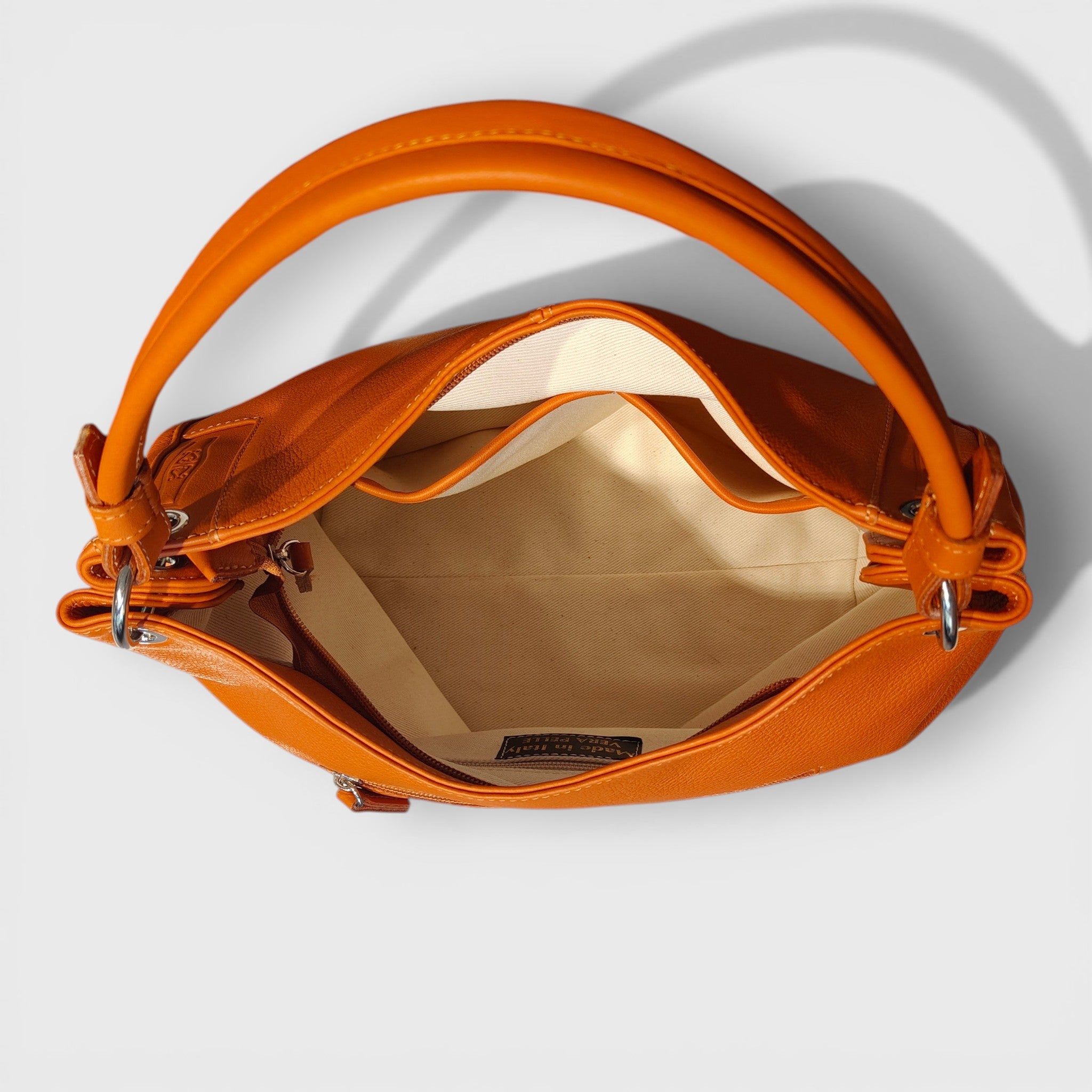 Pelletteria Pelle Nuda Milano, Artigianato Italiano, Vera Pelle, Negozio borse donna, Cris arancione