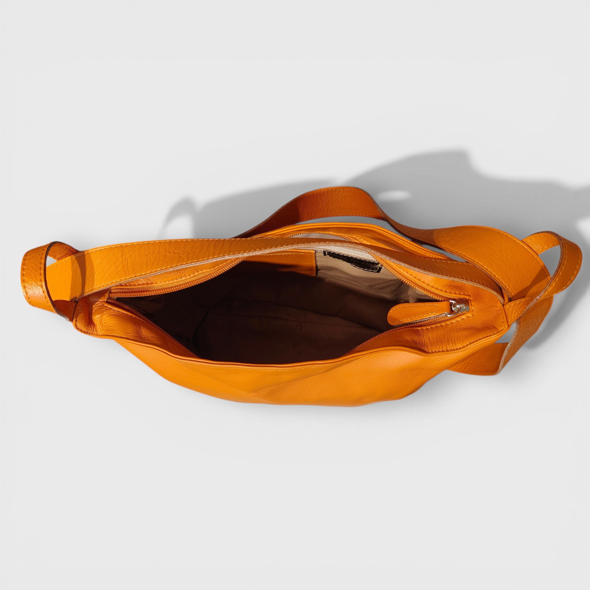 Pelletteria Pelle Nuda Milano, Artigianato Italiano, Vera pelle, Negozio borse donna, Zaino Roma arancione